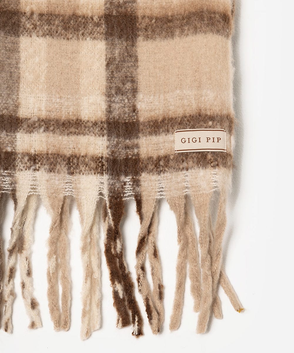 Plaid scarf with fringes and 'GIGI PIP' label on a white background #color_ cream - brown plaid