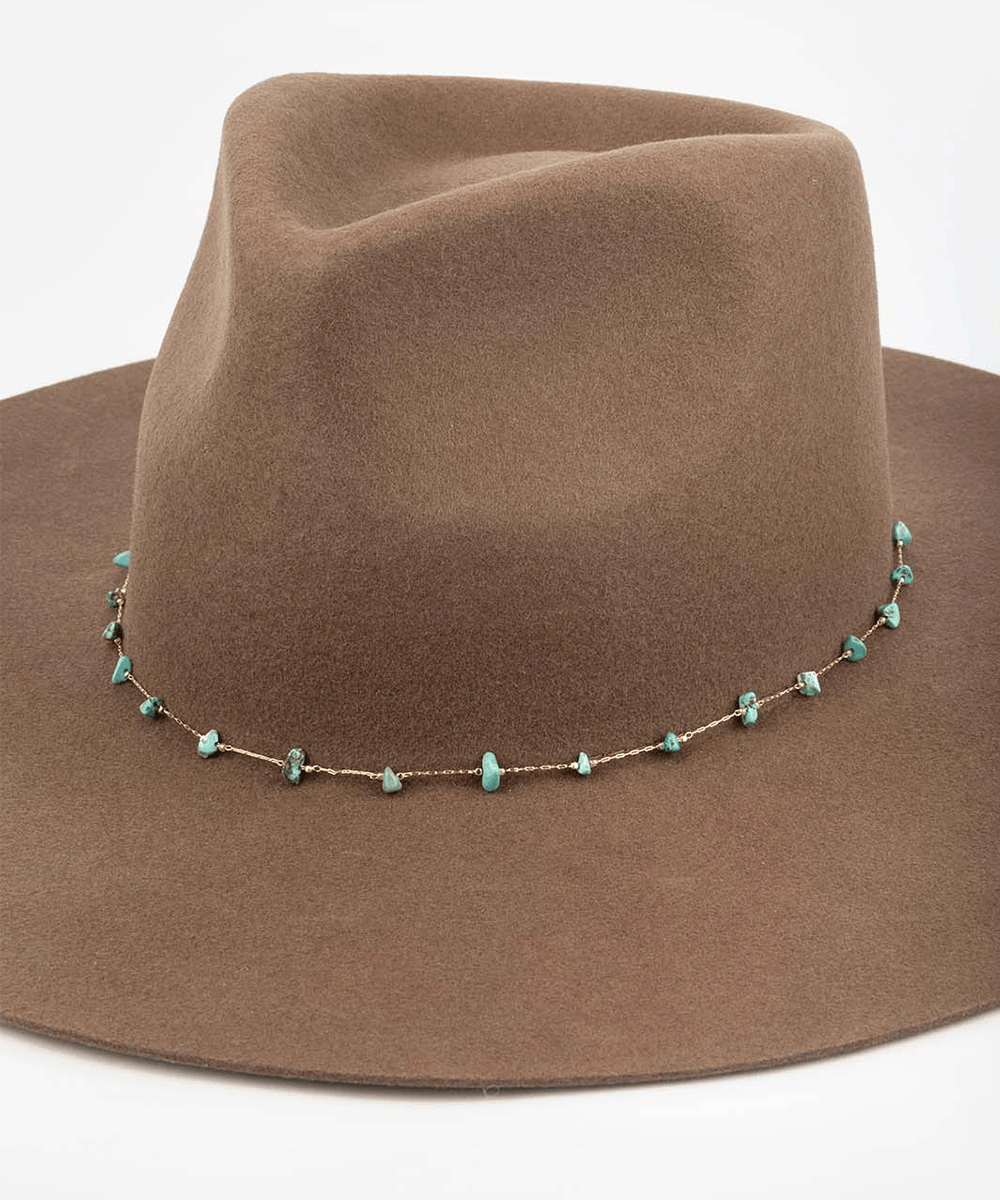 Brown hat with a turquoise beaded necklace on a white background #color_gold