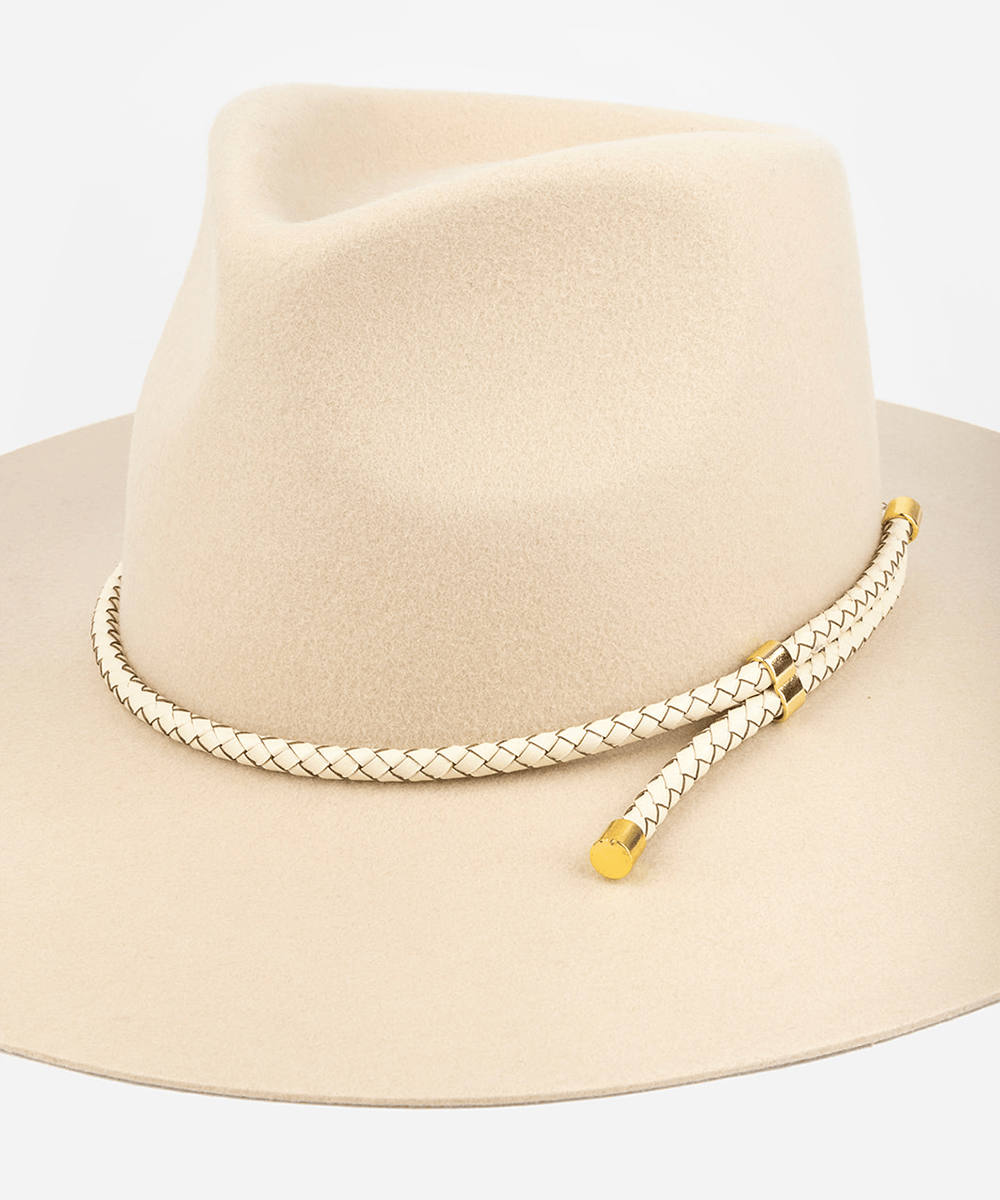 Beige fedora hat with a braided gold band on a light gray background #color_ivory