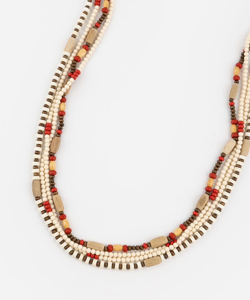 A natural colored layered beaded hat band on a plain background #color_natural