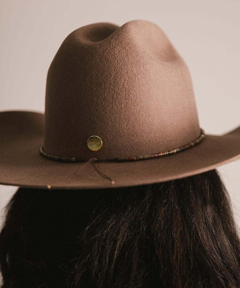 Brown cowboy hat with a visible brand logo on a neutral background #color_brown jasper