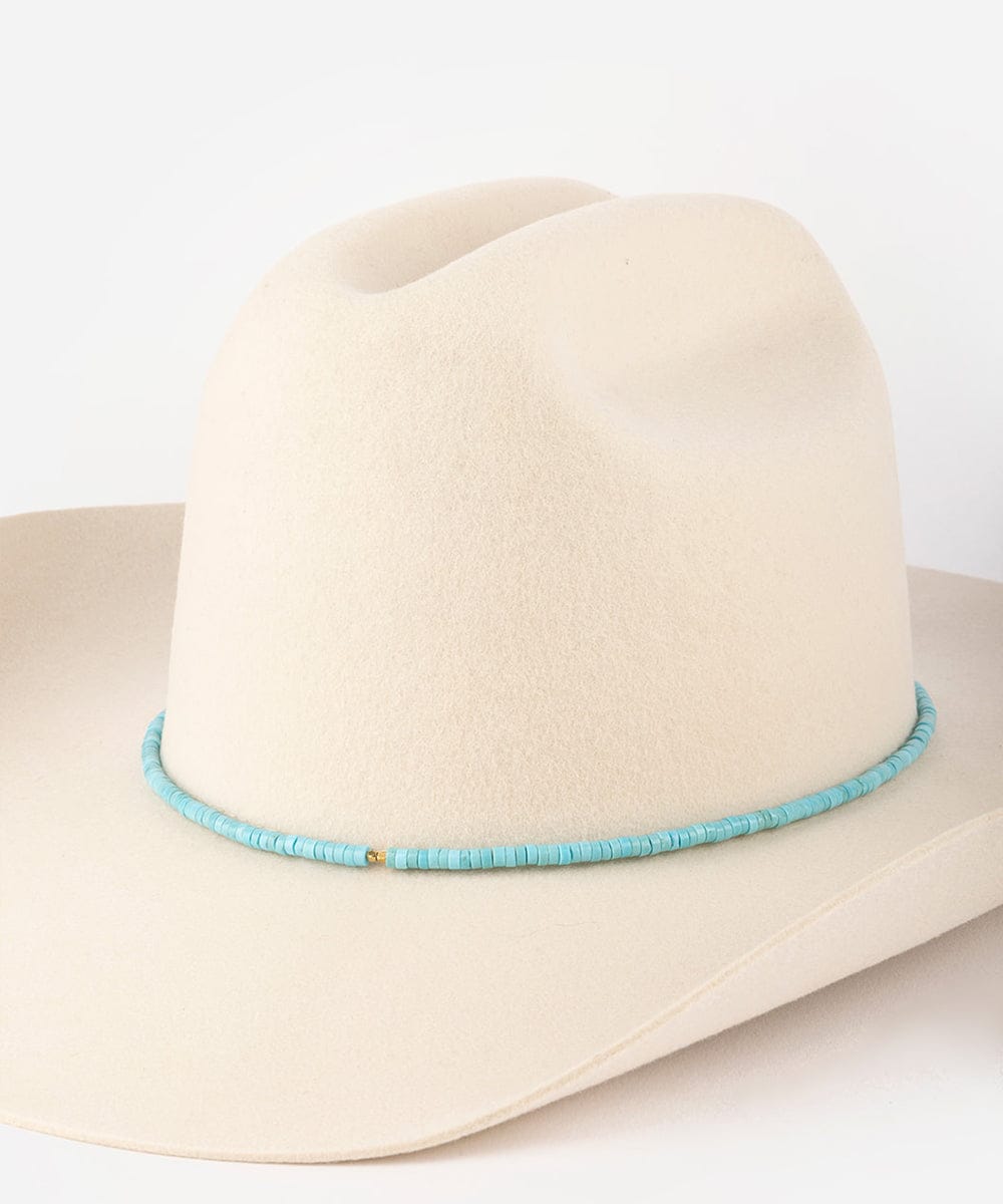 Beige cowboy hat with a turquoise band on a white background #color_turquoise