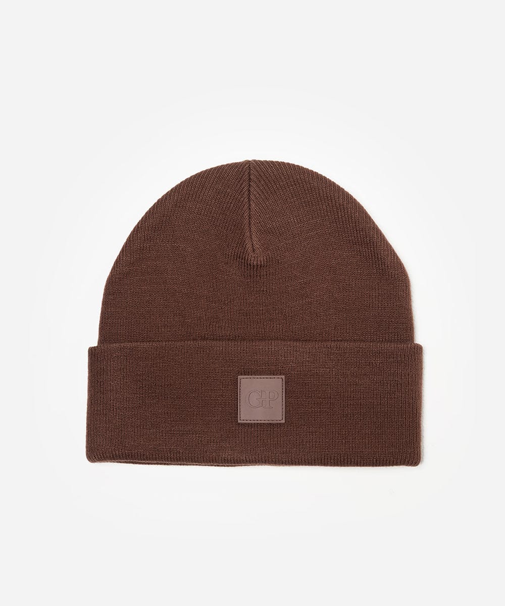 Chocolate colored beanie with the brand logo on a plain background #color_chocolate
