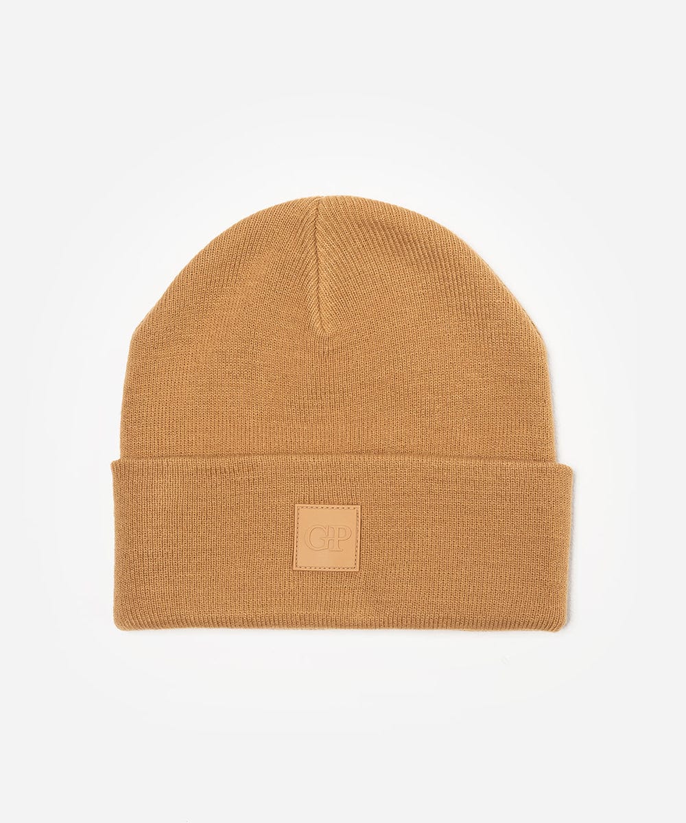 Latte colored beanie with a brand logo on a white background #color_latte