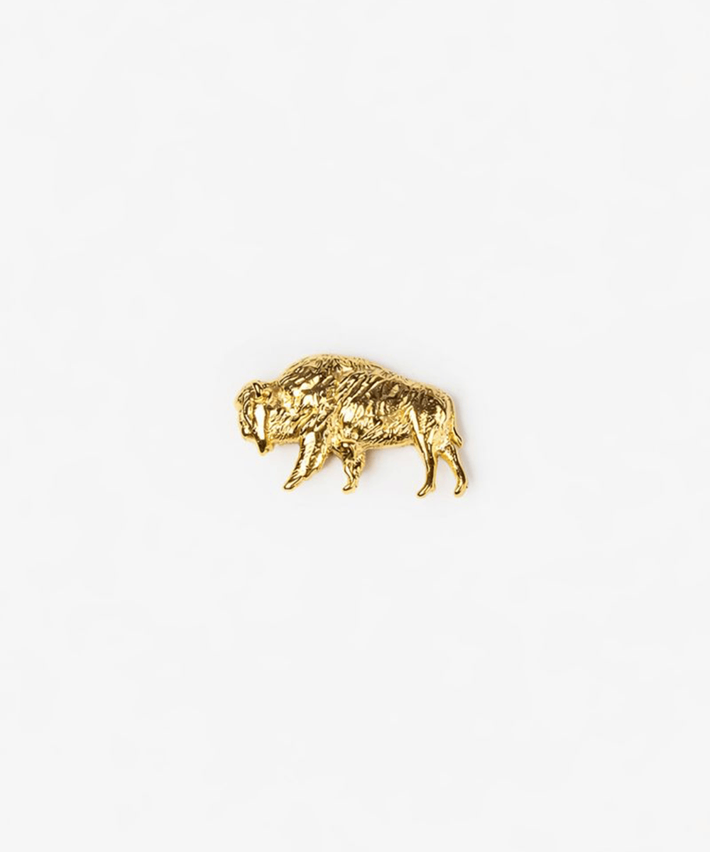 Gold buffalo hat charm on a white background #color_gold