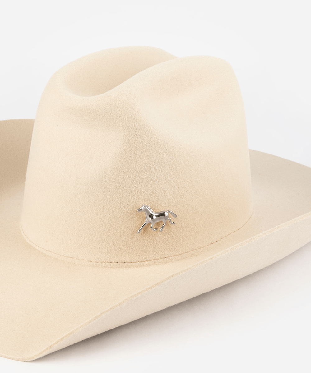 Pink cowboy hat with a silver horse hat pin on a white background #color_silver