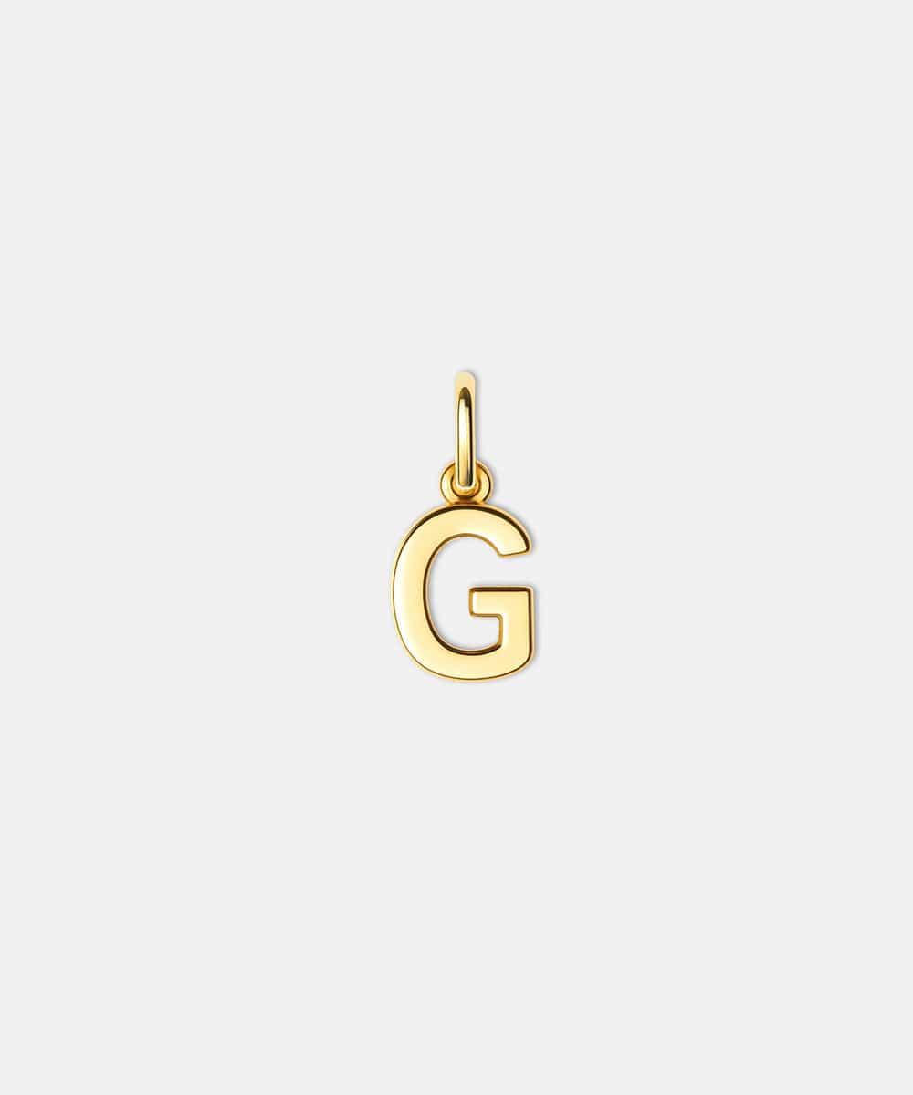Gold letter 'G' hat charm on a white background #color_gold