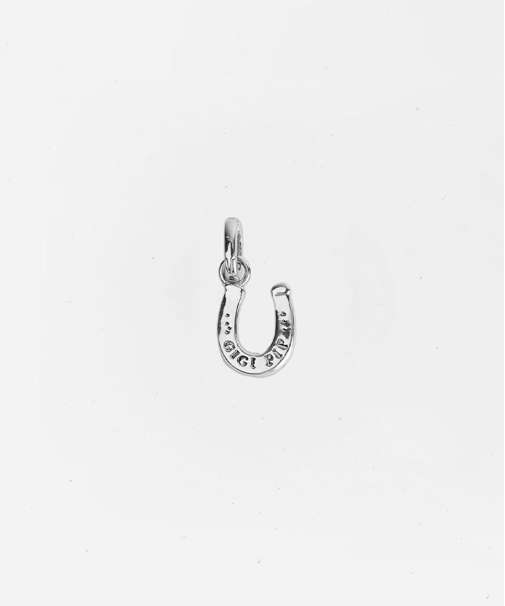 Silver horseshoe charm on a white background #color_silver