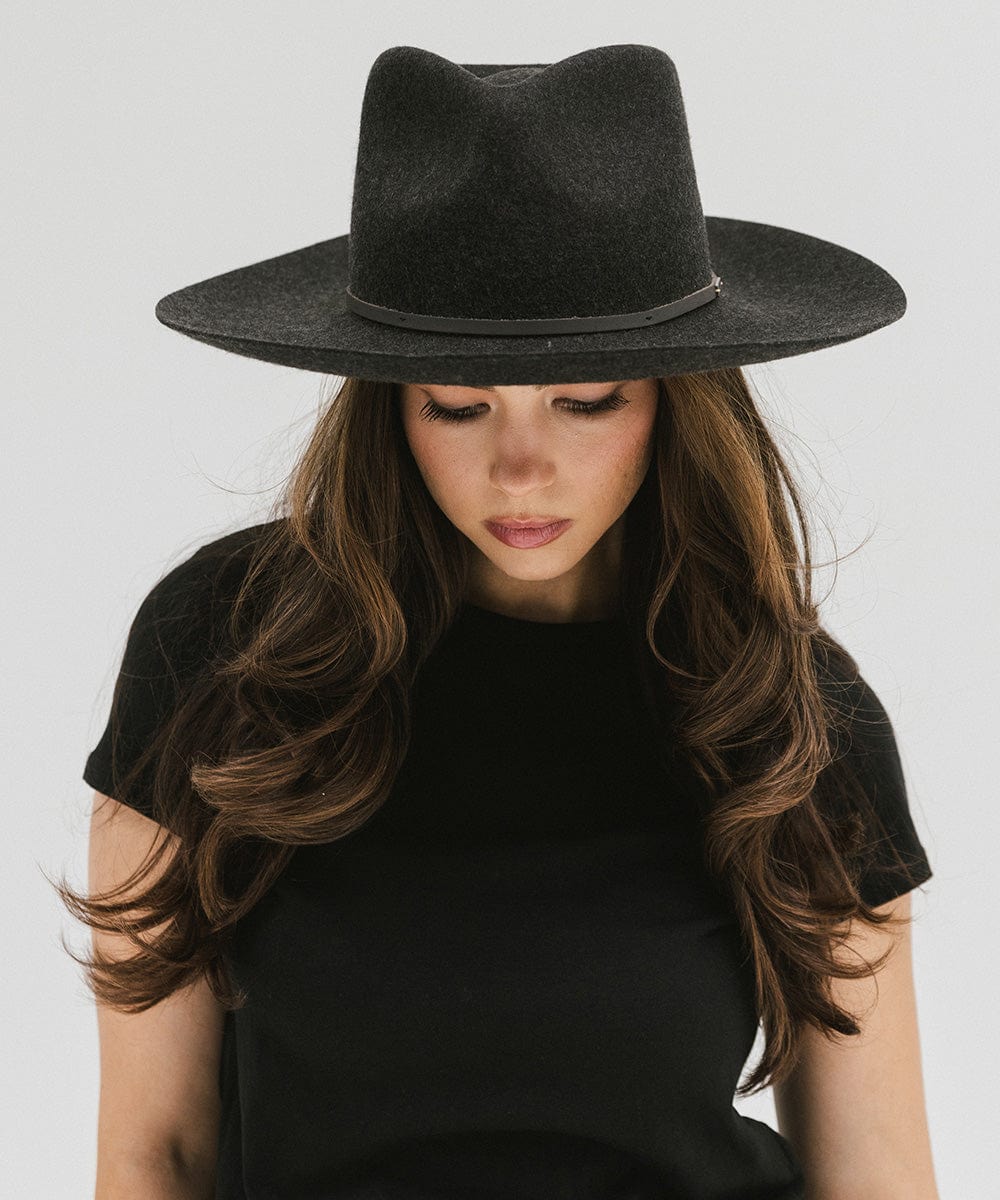 Woman wearing a mix charcoal  colored Rowan Wide Brim Fedora Hat with a hat band and a black t-shirt against a plain background  #color_mix charcoal