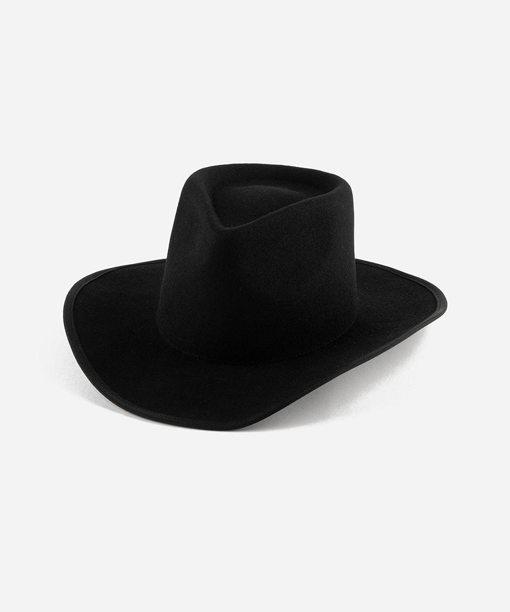 A black felt Western hat with a teardrop-shaped crown and an angled brim, bound with a tonal grosgrain ribbon around the brim edge. #color_black