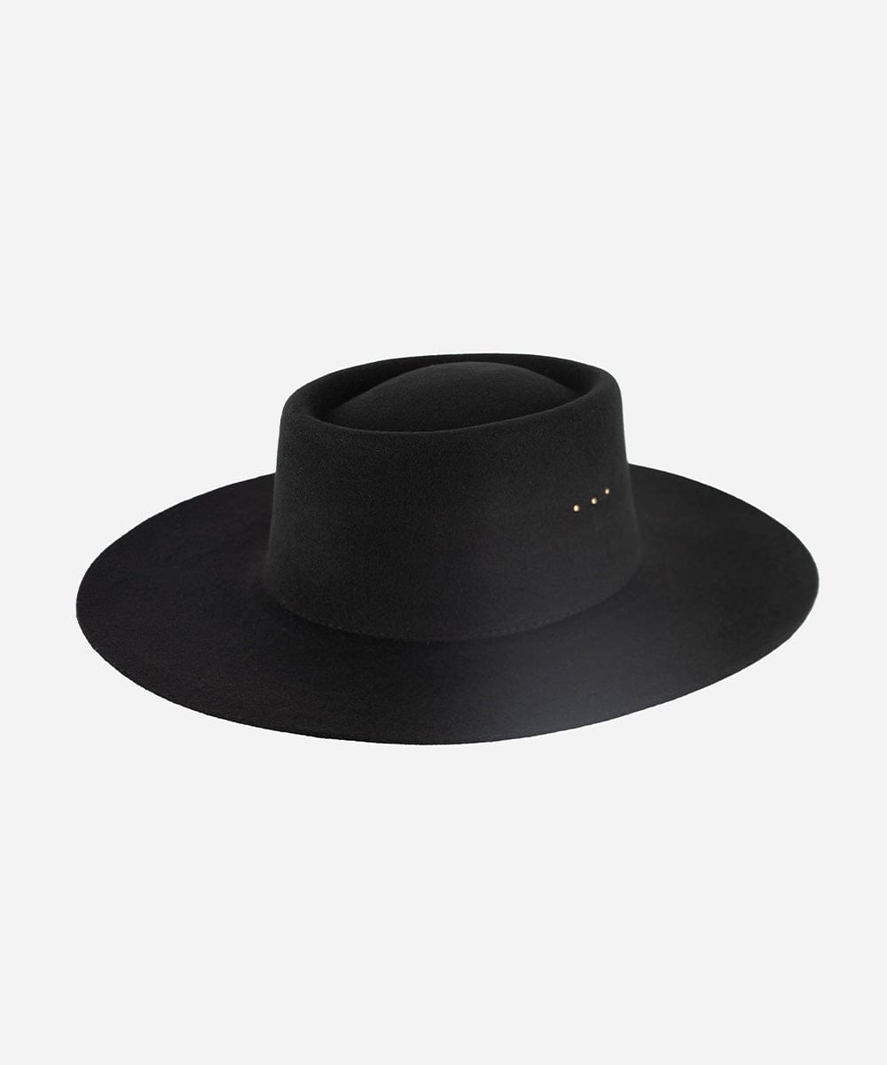 A black boater hat with a minimalistic design and three gold plated studs on the crown. #color_black