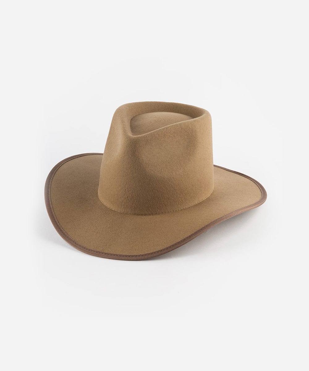 A brown felt Western hat with a teardrop-shaped crown and an angled brim, bound with a tonal grosgrain ribbon around the brim edge. #color_brown