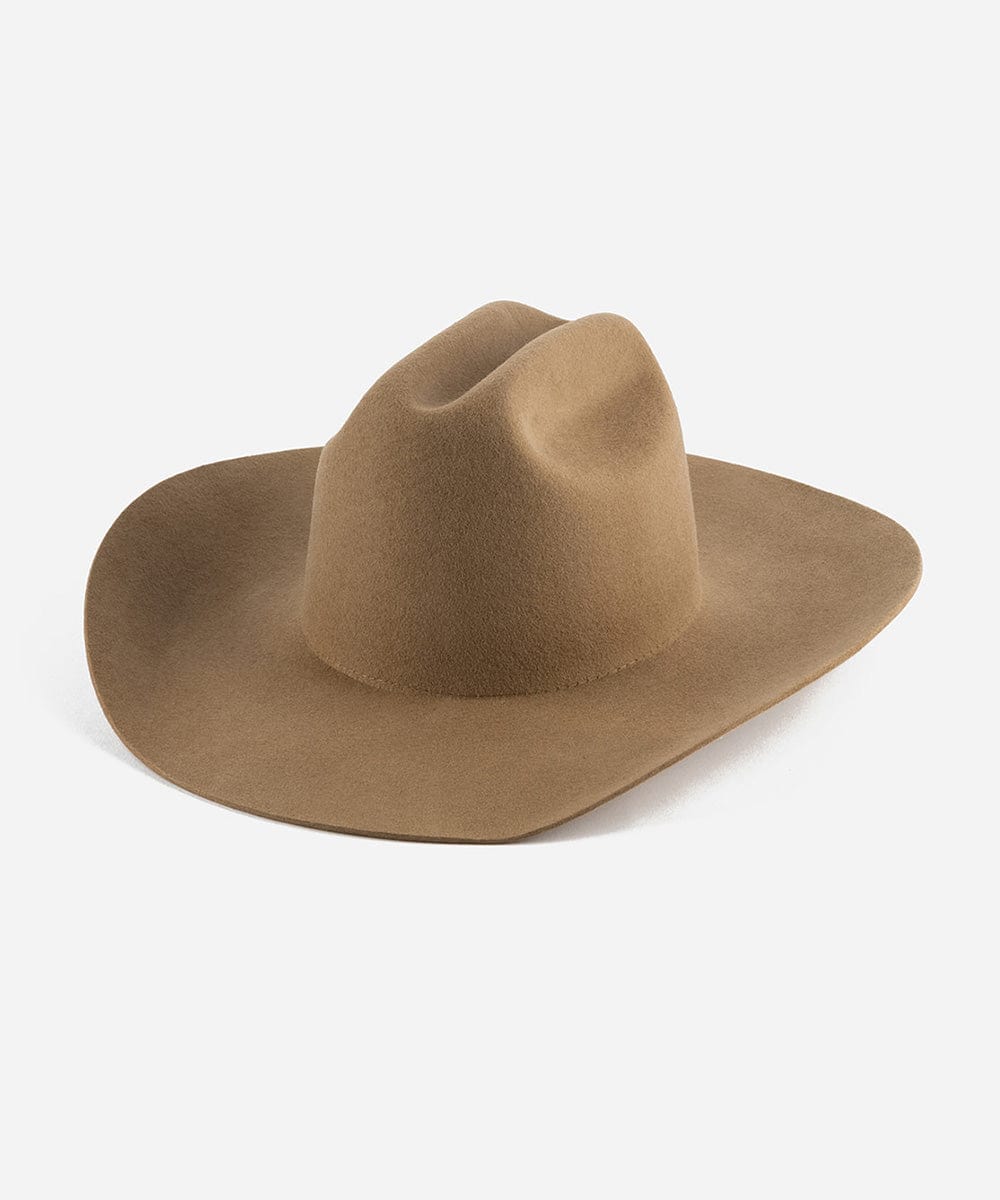 A brown cowboy hat with a wide brim and a true western cattleman crown. #color_brown