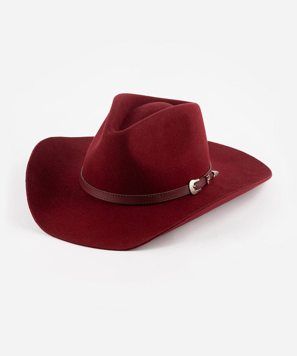 A burgundy cowboy hat with a pinched crown and an attached leather band with a silver buckle. #color_burgundy