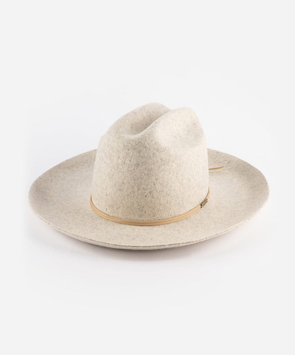 A mix grey colored Western hat with a classic cattleman crown and an upturned brim. It features a tall crown and a stiff brim with a tonal grosgrain band and a brass Gigi Pip pin. #color_mix grey