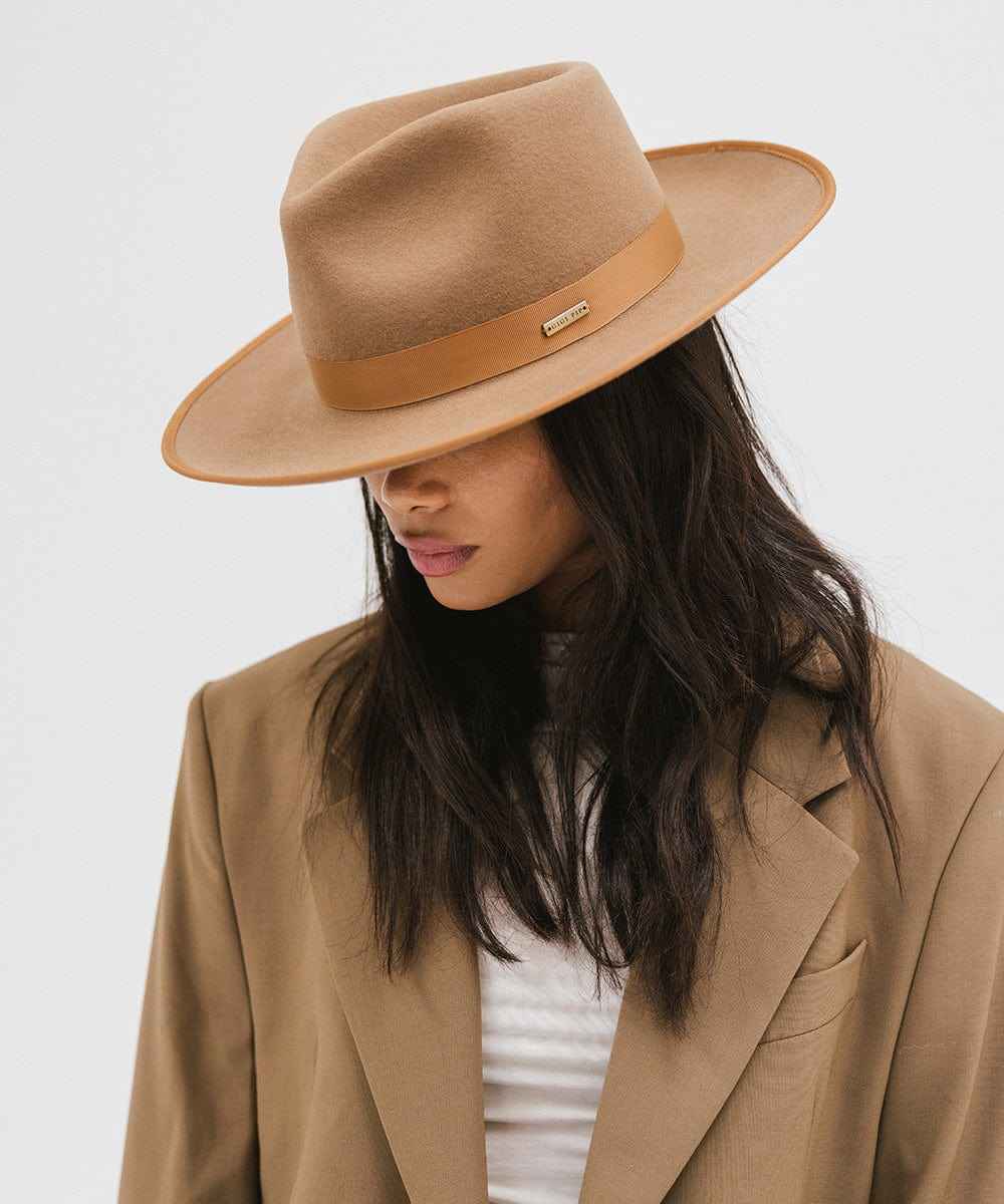 Woman wearing a brown hat with a tan band and coat on a white background #color_brown