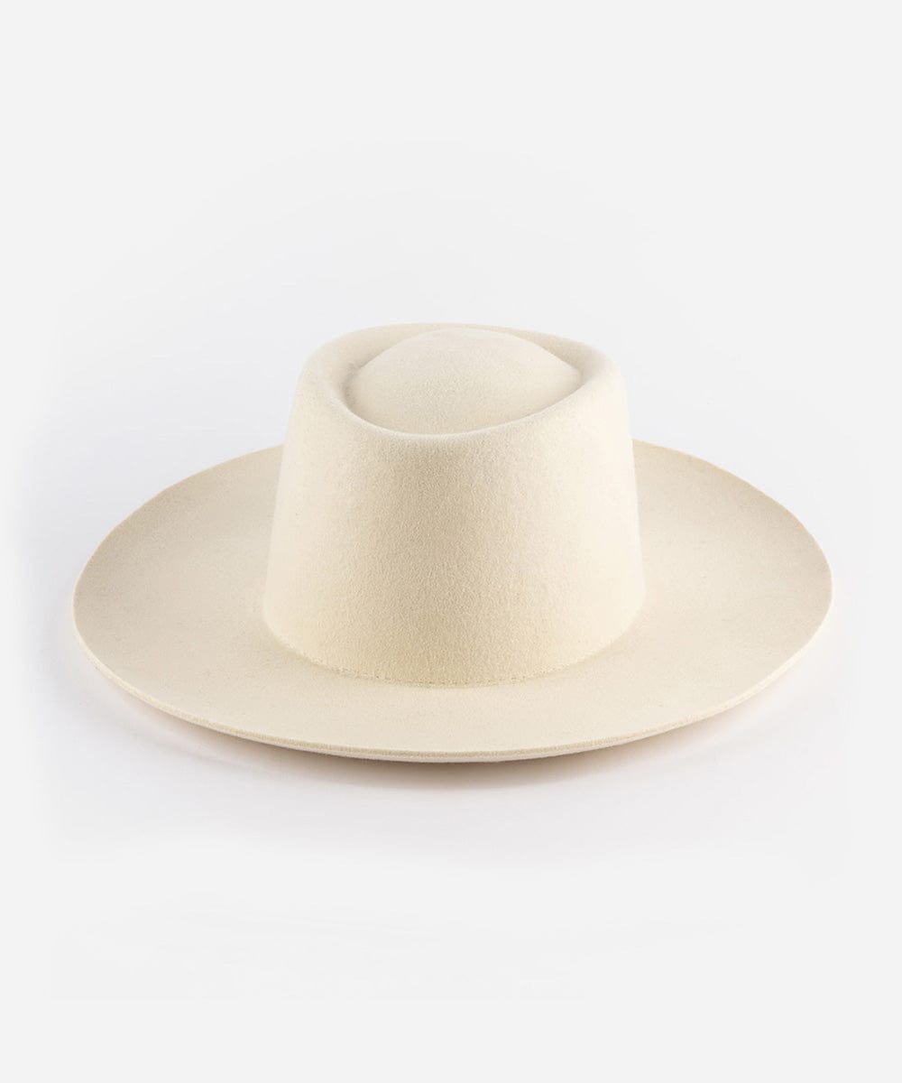 An off white gambler hat with an upturned brim, made of felt, displayed on a plain background. #color_off white