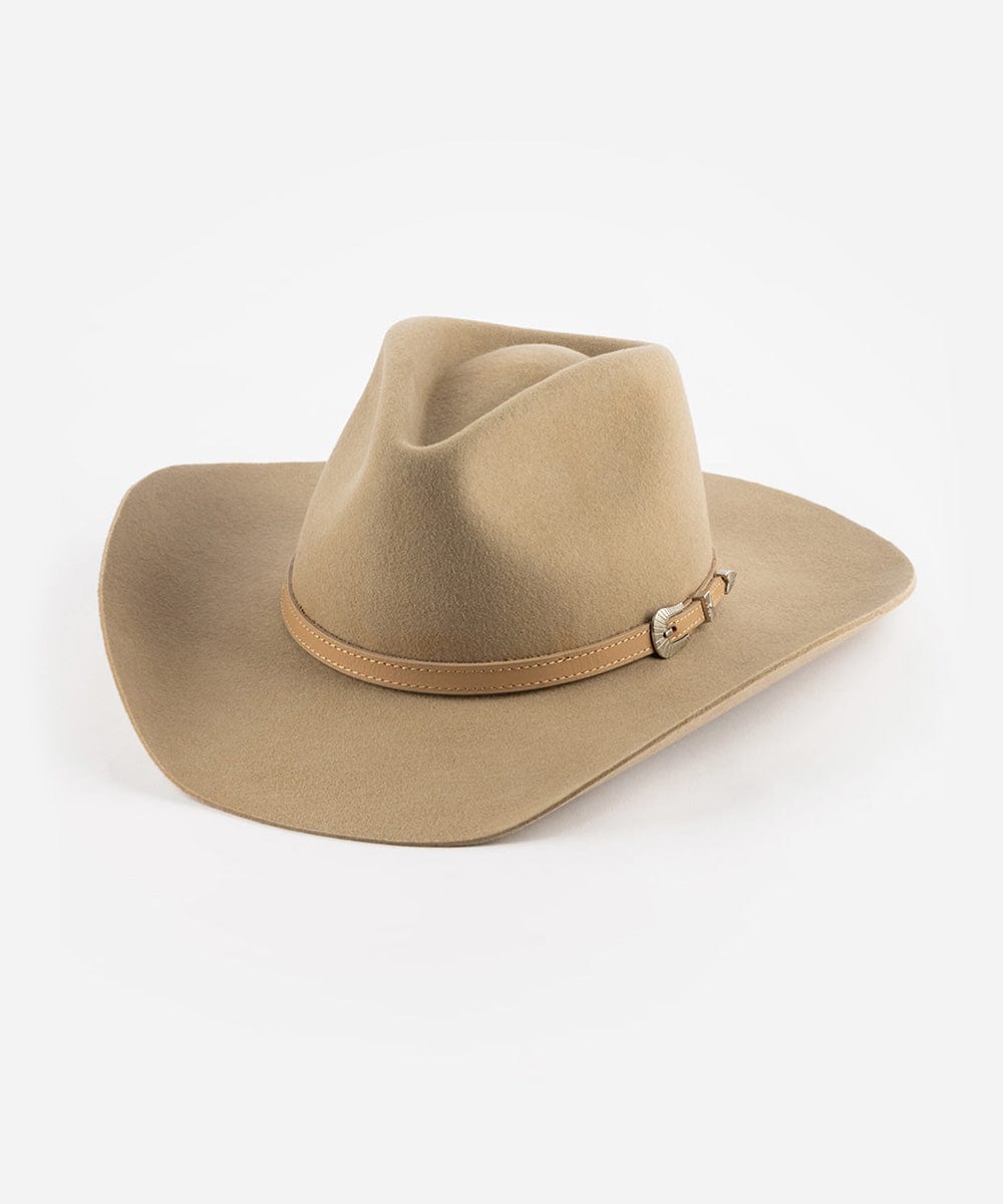 A beige cowboy hat with a pinched crown and an attached leather band with a silver buckle. #color_tan