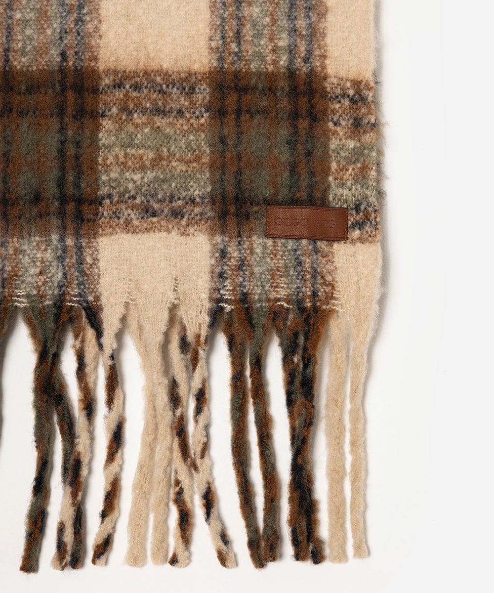 Plaid scarf with fringes and a brand label on a white background #color_cream - tan