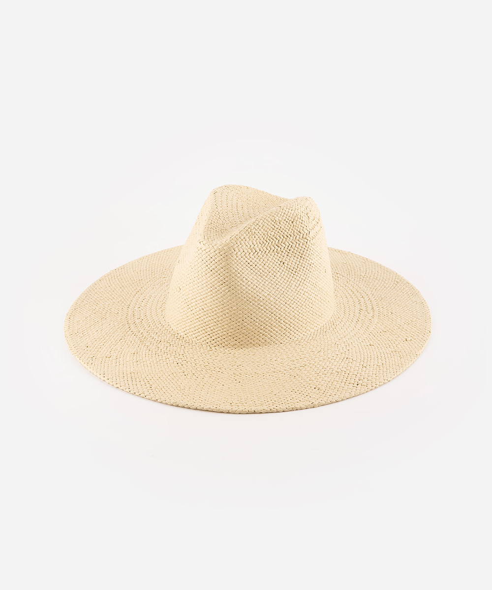 A natural colored wide brim fedora straw hat on a plain background. #color_natural