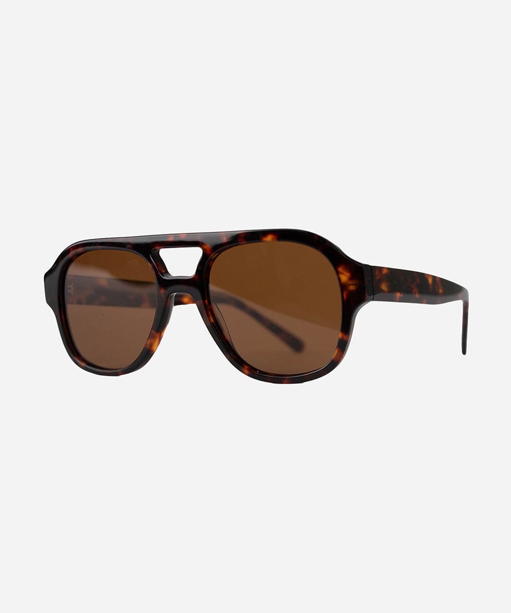 A pair of retro aviator sunglasses with an oversized frame and lighter lenses, featuring a patterned design of a tortoiseshell color. #color_tortoise