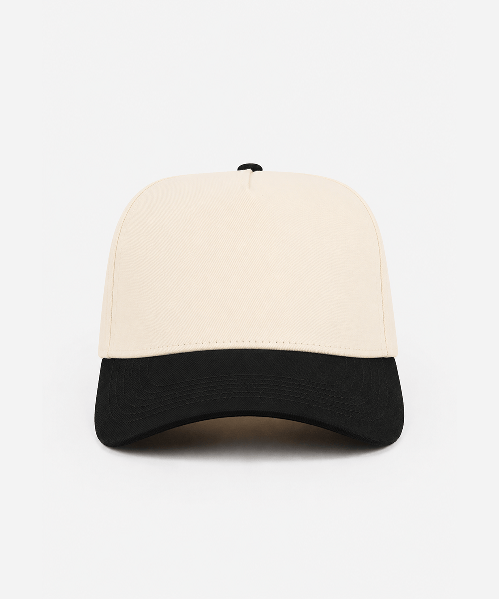 Two-tone beige and black cap on a white background #color_cream - black