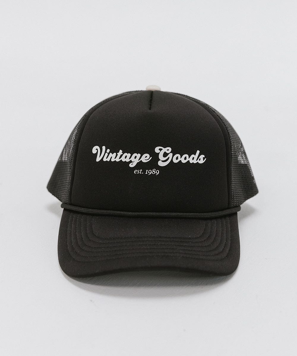 A black trucker hat with 'Vintage Goods' text on a white background #color_black