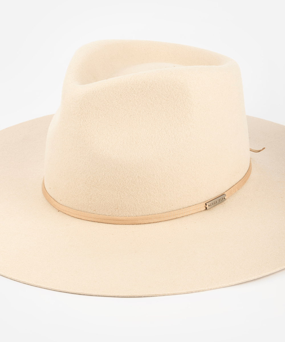Pink cowboy hat with a dusty pink colored grosgrain band on a white background #color_dusty pink