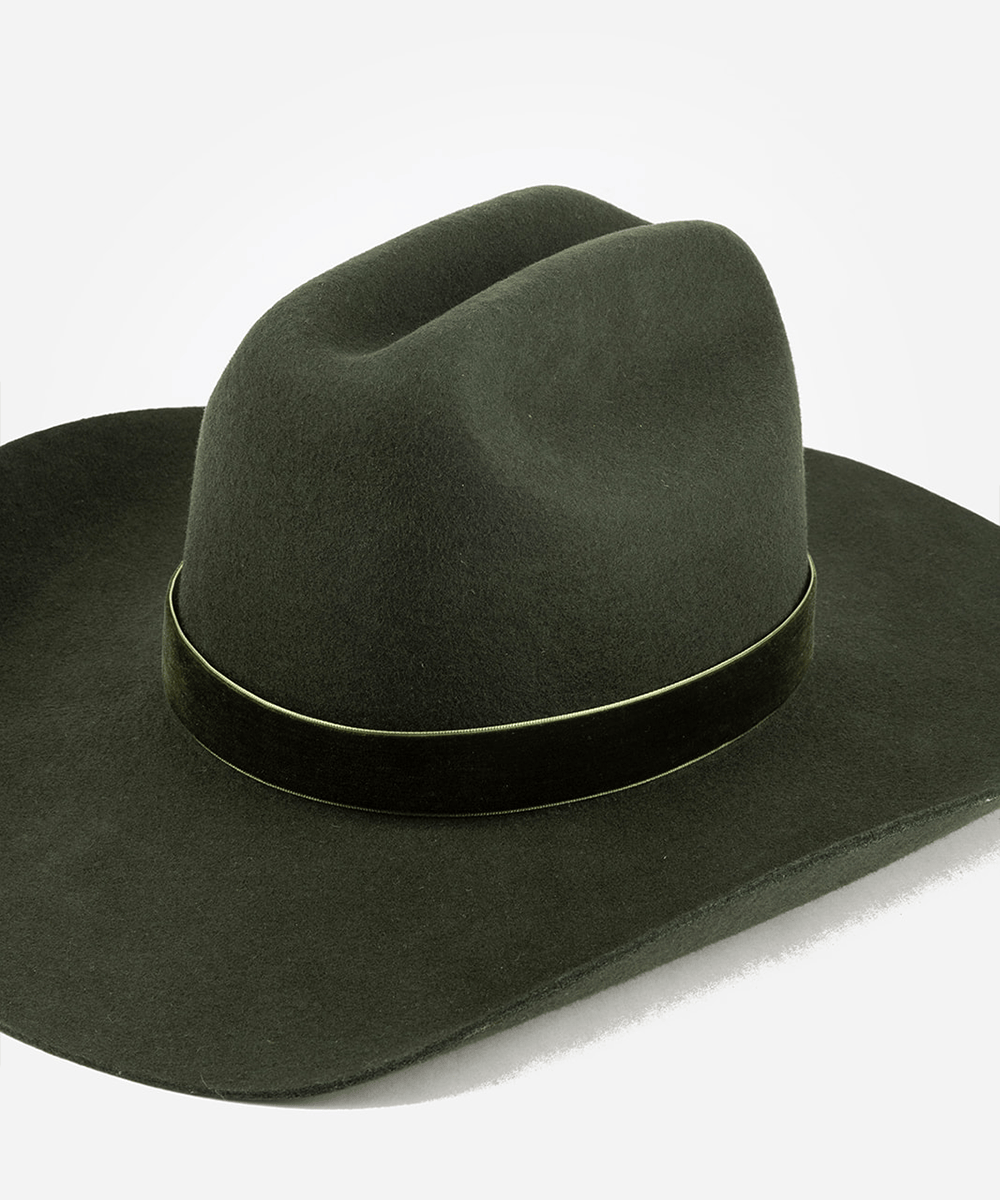Dark green cowboy hat with a forest green velvet chain band on a white background #color_forest green