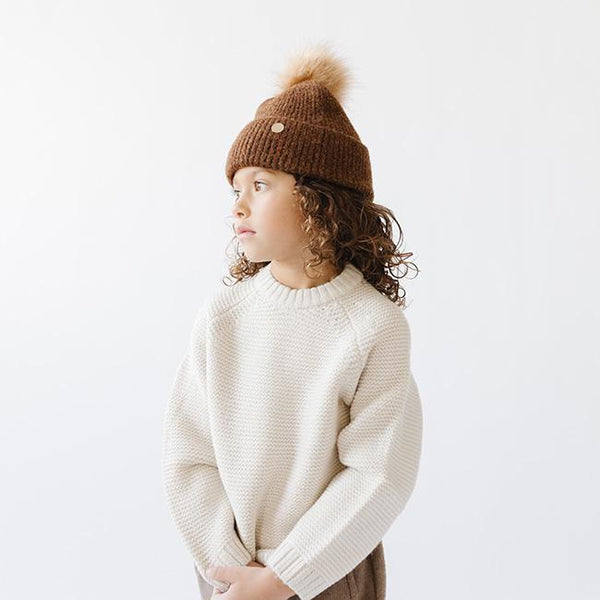 Gigi Pip beanies for kids - Milo Beanie - soft knit ribbers kid's beanie featuring a fold up brim with a rose gold Gigi Pip logo pin on the side of the fold and a pom pom on the center of the crown [chocolate brown]