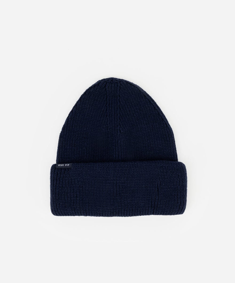 Navy blue beanie hat on a white background #color_navy