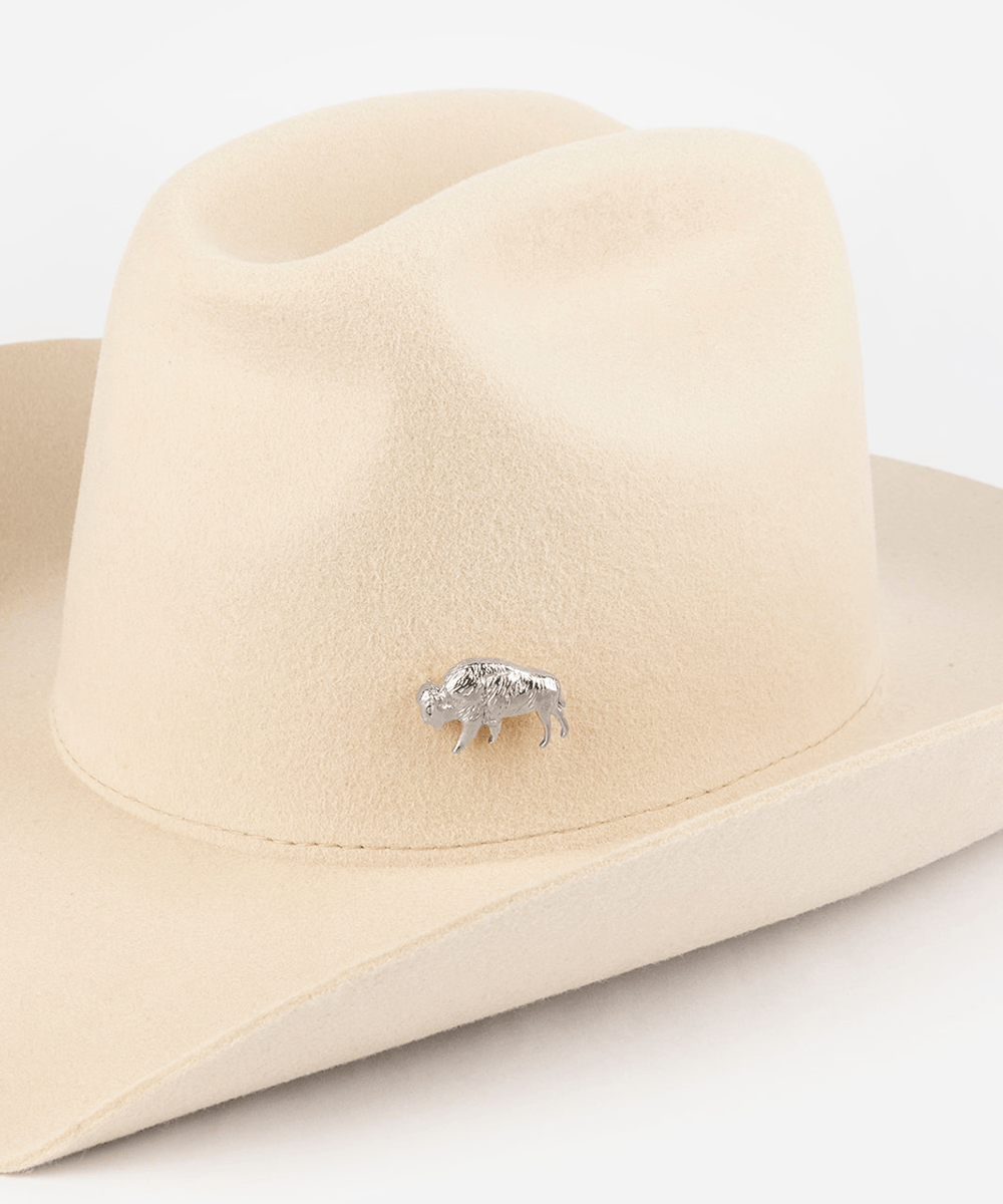 Pink cowboy hat with a silver buffalo-shaped hat pin on a white background #color_silver