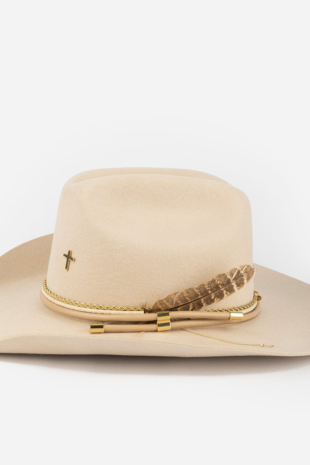 Beige cowboy hat with decorative elements on a white background #color_gold