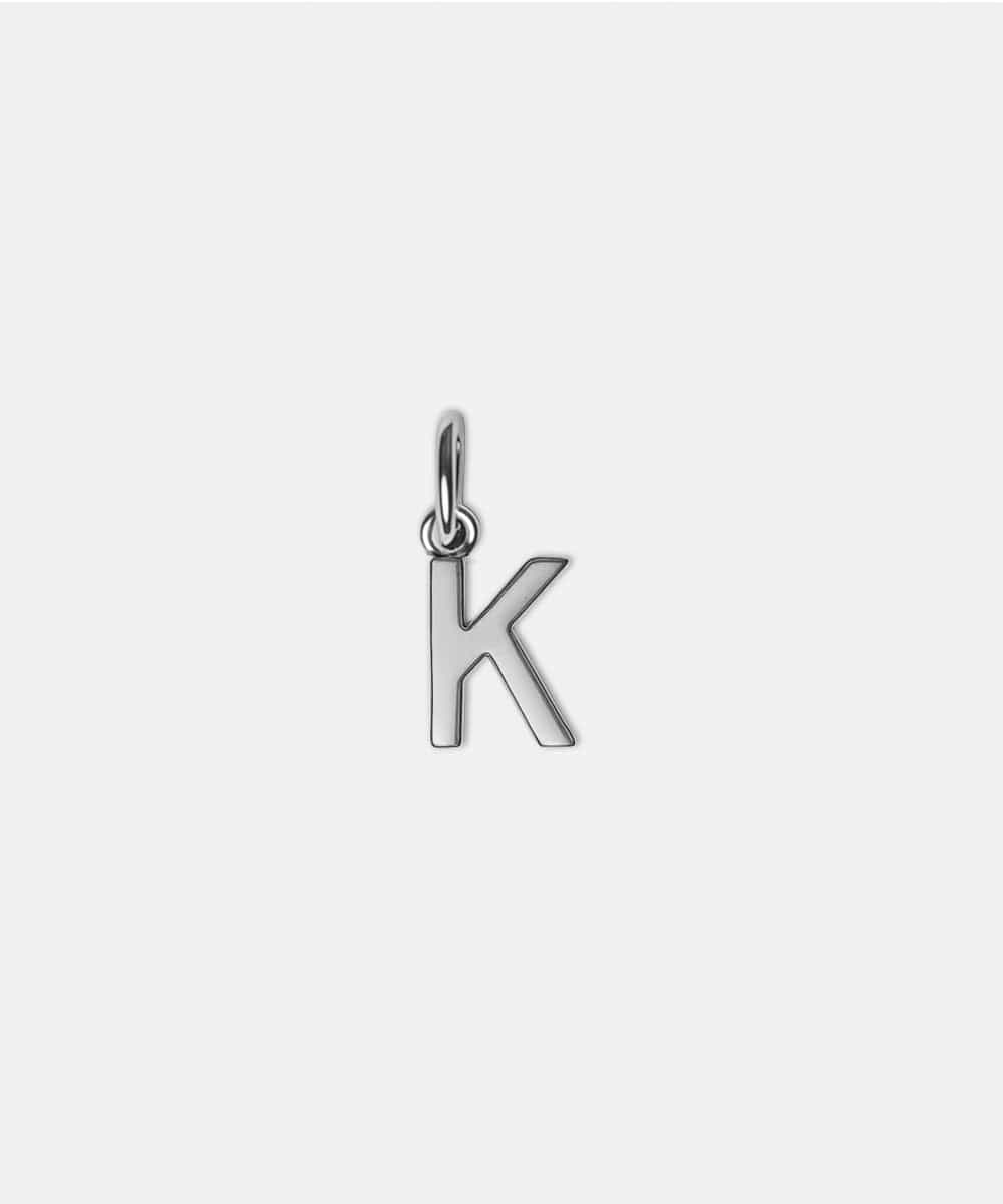 Silver letter 'K' hat charm on a white background #color_silver