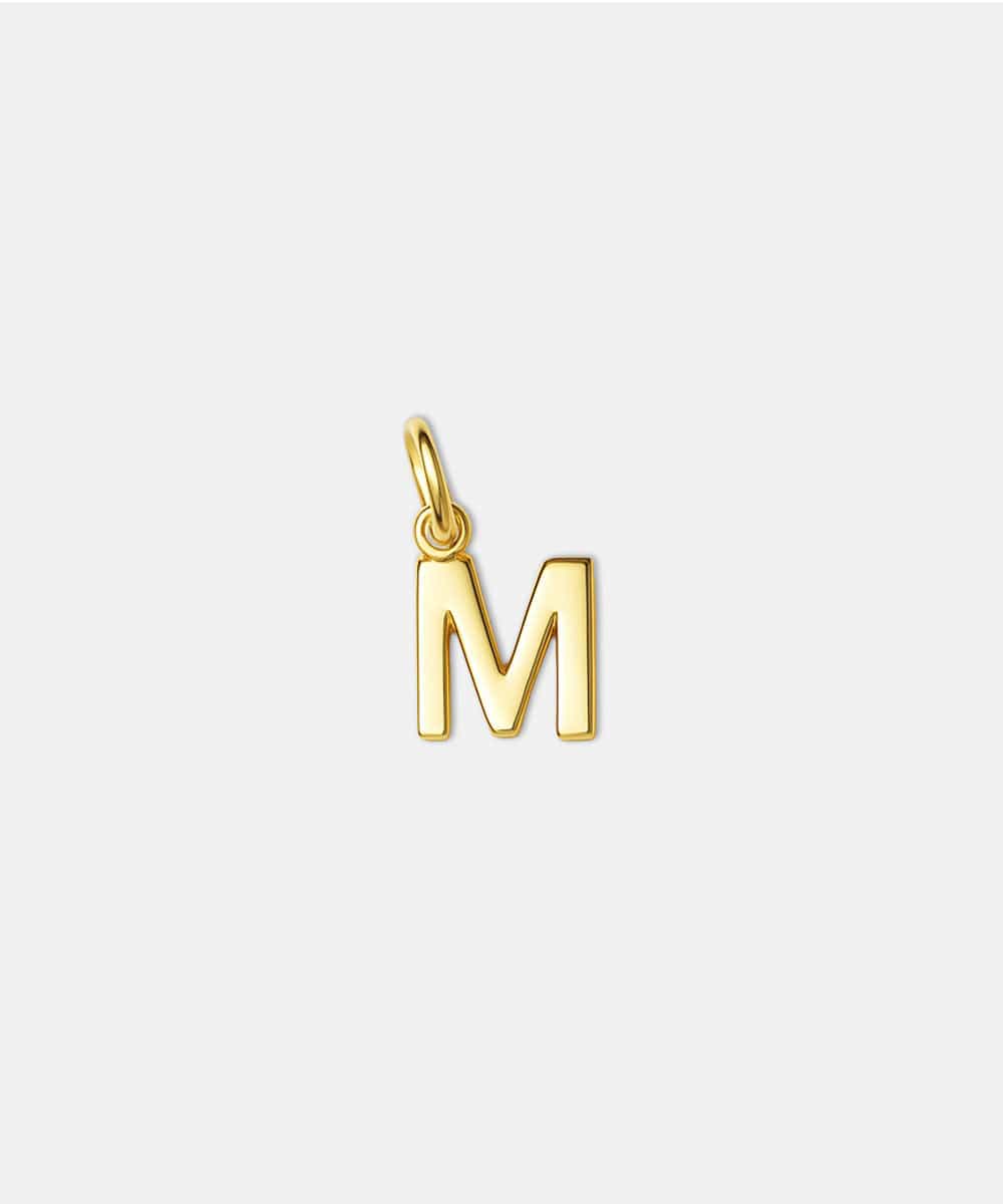Gold letter 'M' hat charm on a white background #color_gold