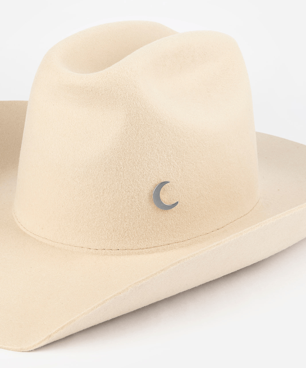 Pink cowboy hat with a silver moon-shaped hat pin on a white background #color_silver