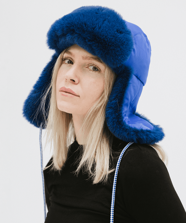 Gigi Pip winter hats for women - Leda Trapper Hat - 100% faux fur + polyester classic style inspired trapper hat featuring a retro limited edition holiday Gigi Pip logo [alpine blue]