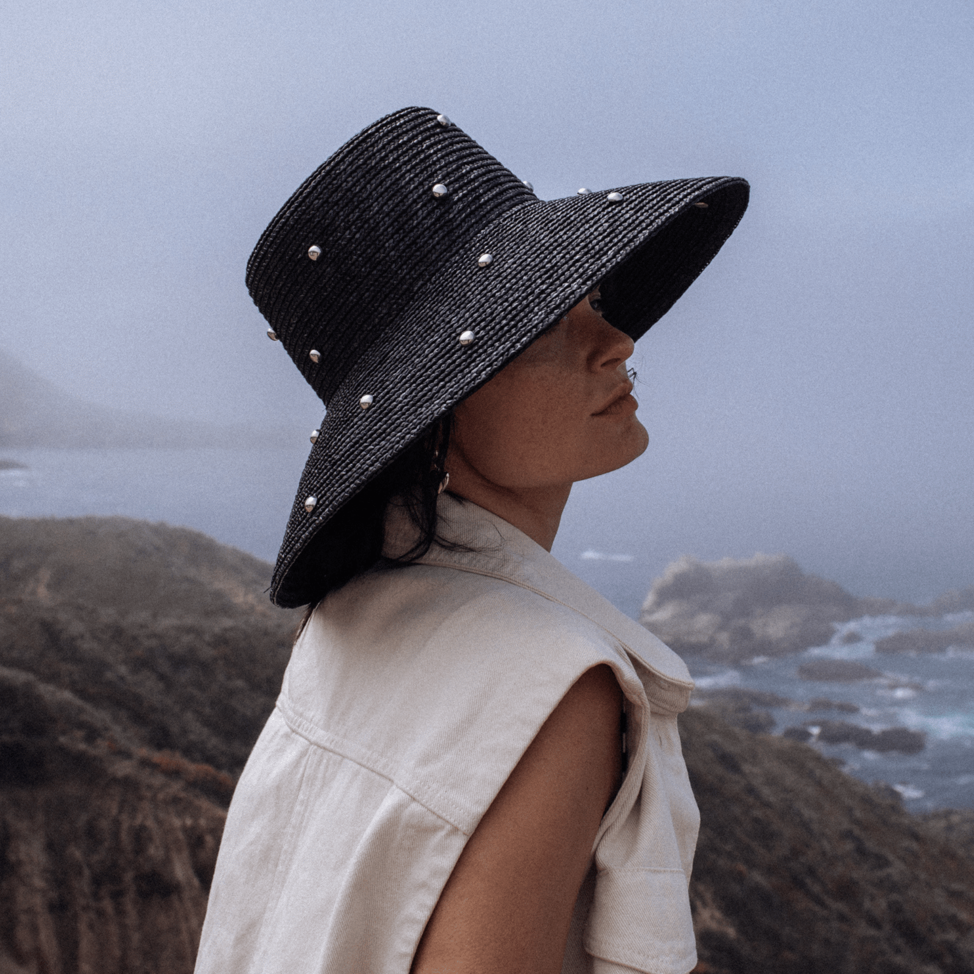 Gigi Pip limited edition hats for women - Limited Edition Hat 24 - bell shaped straw with a boater crown and a sloped brim, featuring silver metal rivets around the crown + the brim [black]