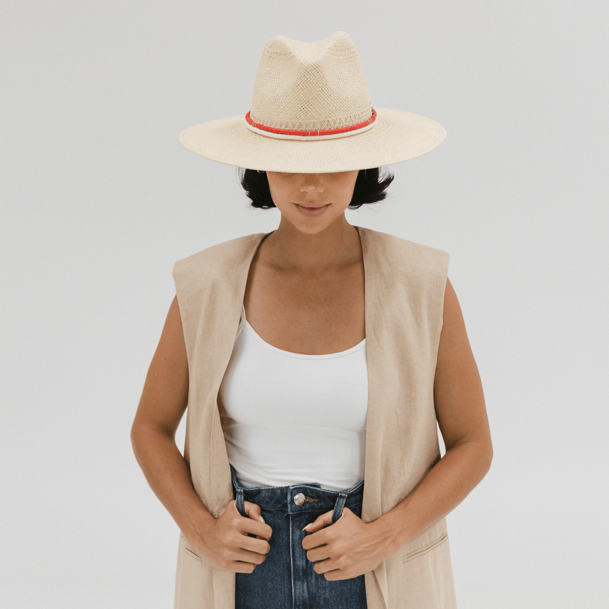 Gigi Pip Limited Edition hats for women - Limited Edition Hat 27 - wide A-line brim straw with an attached tonal straw band, featuring a red clay beaded band + a cream clay beaded band [cream]