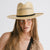 Gigi Pip panama straw for women - Saguaro Wide Brim Natural - a pinched fedora crown with a wide and slightly upturned brim, featuring a matte black leather band that is Gigi Pip embossed around the crown [natural]