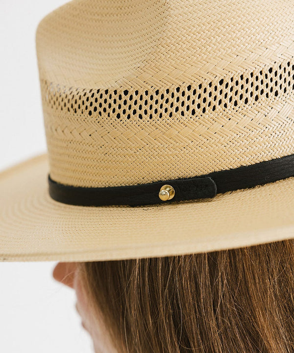 Gigi Pip panama straw for women - Saguaro Wide Brim Natural - a pinched fedora crown with a wide and slightly upturned brim, featuring a matte black leather band that is Gigi Pip embossed around the crown [natural]
