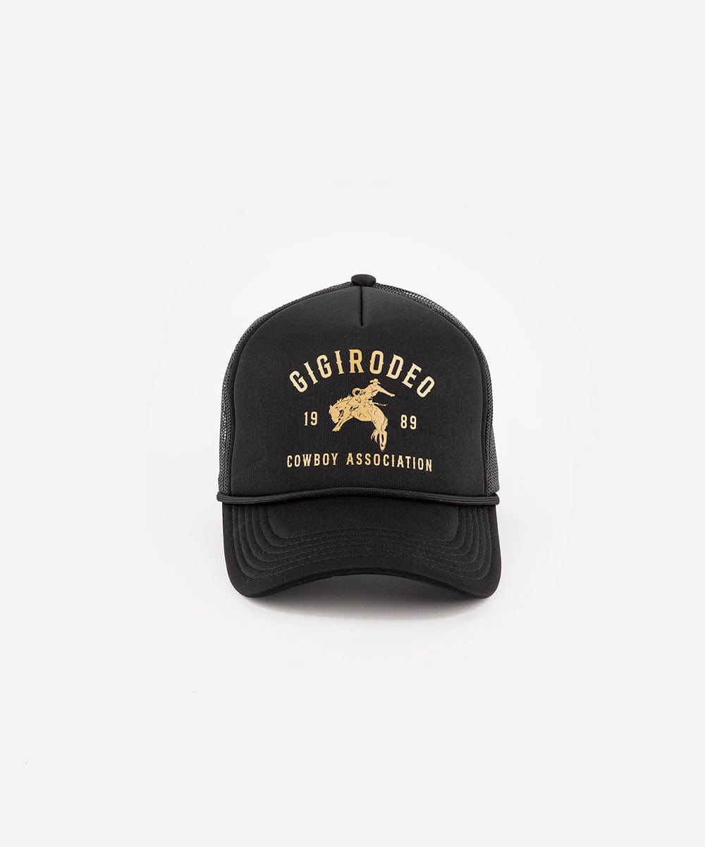 Black cap with gold text and logo on a white background Gigi Rodeo Trucker Hat - GIGI PIP #color_black