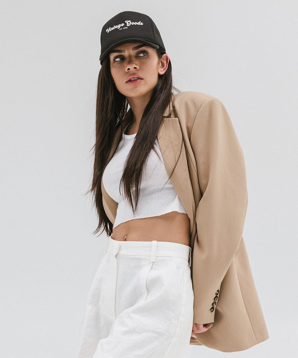Gigi Pip trucker hats for women - Vintage Goods Foam Trucker Hat - 100% polyester foam + mesh trucker hat with a curved brim featuring the words "vintage goods" in a contrasting color as a design across the front panel [black]