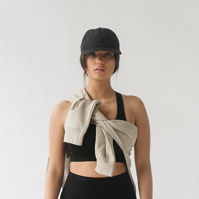 Gigi Pip ball caps for women - Benny Athletic Runner Ball Cap - 100% nylon and sweat resisting athletic ball cap with an adjustable sinch closure in the back, featuring the Gigi Pip logo embroidered on the center of the front panel [black]