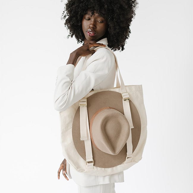 Gigi Pip hat carrying totes for women - Canvas Hat Carrying Tote - 100% organic cotton canvas with a genuine leather Gigi Pip branded detailing, featuring two adjustable straps to secure your hat to your tote [natural]