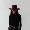 Gigi Pip felt hats for women - Raine Wide Brim Fedora - wide flat brim with a fedora crown, featuring a gold-plated removable paperclip brass chain with three faux pearls and a hand-sewn grosgrain band with the gold Gigi Pip bar around the crown, as well as a removable golden chain chinstrap [dark cherry]