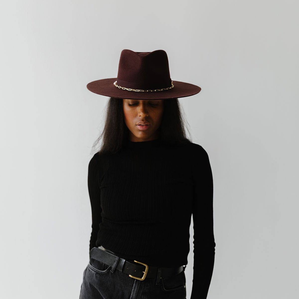 Gigi Pip felt hats for women - Raine Wide Brim Fedora - wide flat brim with a fedora crown, featuring a gold-plated removable paperclip brass chain with three faux pearls and a hand-sewn grosgrain band with the gold Gigi Pip bar around the crown, as well as a removable golden chain chinstrap [dark cherry]