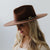 Gigi Pip felt hats for women - Raine Wide Brim Fedora - wide flat brim with a fedora crown, featuring a gold-plated removable paperclip brass chain with three faux pearls and a hand-sewn grosgrain band with the gold Gigi Pip bar around the crown, as well as a removable golden chain chinstrap [black]