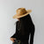 Gigi Pip felt hats for women - Raine Wide Brim Fedora - wide flat brim with a fedora crown, featuring a gold-plated removable paperclip brass chain with three faux pearls and a hand-sewn grosgrain band with the gold Gigi Pip bar around the crown, as well as a removable golden chain chinstrap [black]
