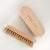 Gigi Pip hat care products - a handheld hat cleaning brush to remove dirt + lint made of wood + features the Gigi Pip name engraved on the handle [natural]